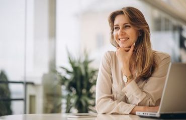 Portrait of a business woman working on laptop